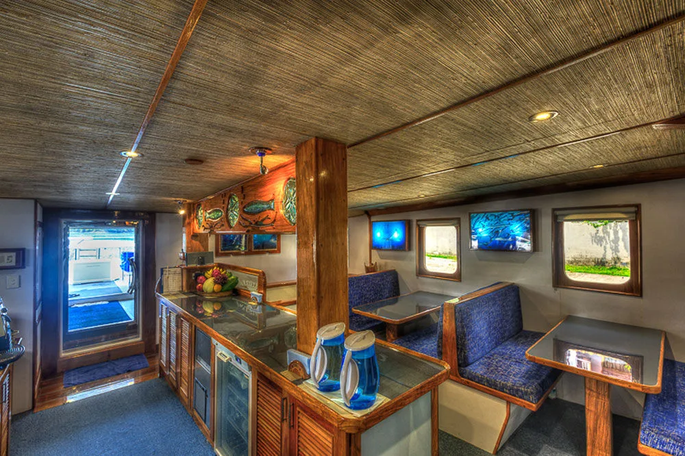 Dining room of Ocean Hunter 3 with banquettes