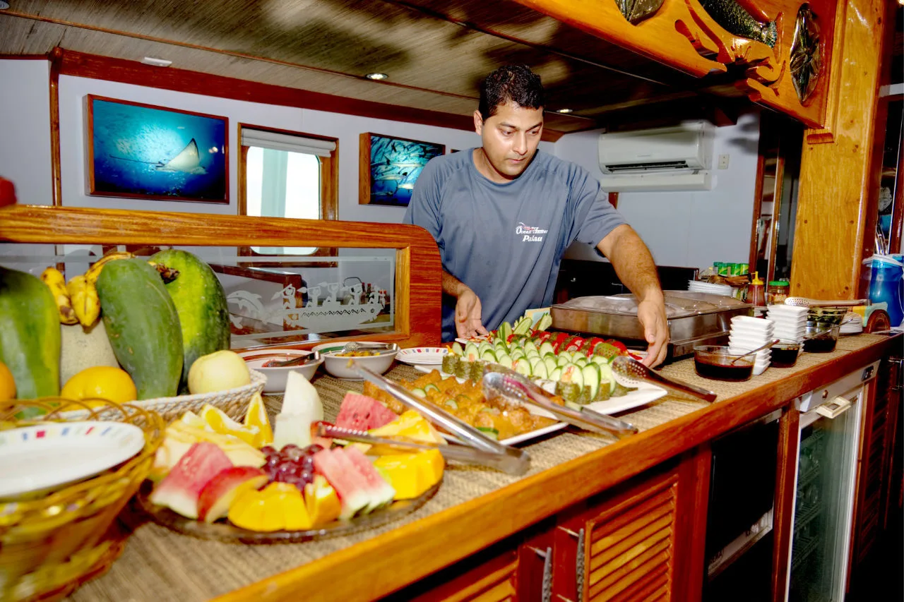 Chef of Ocean Hunter 3 at the laid table