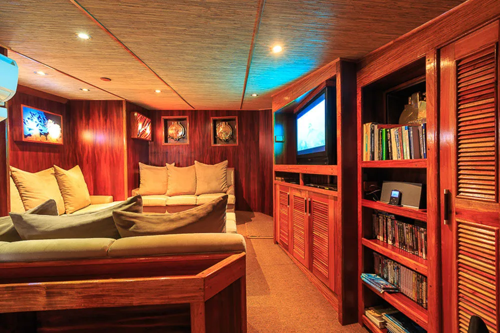 Master state room of Ocean Hunter 3 with bookshelves