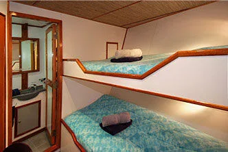 Standard cabin on Ocean Hunter 3 — basin and storage area