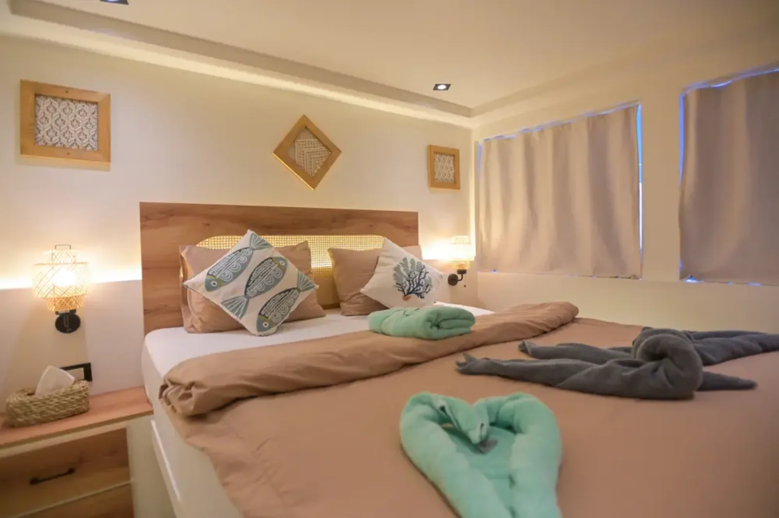 Upper-deck suite on Ocean Lovers — double bed beneath the windows