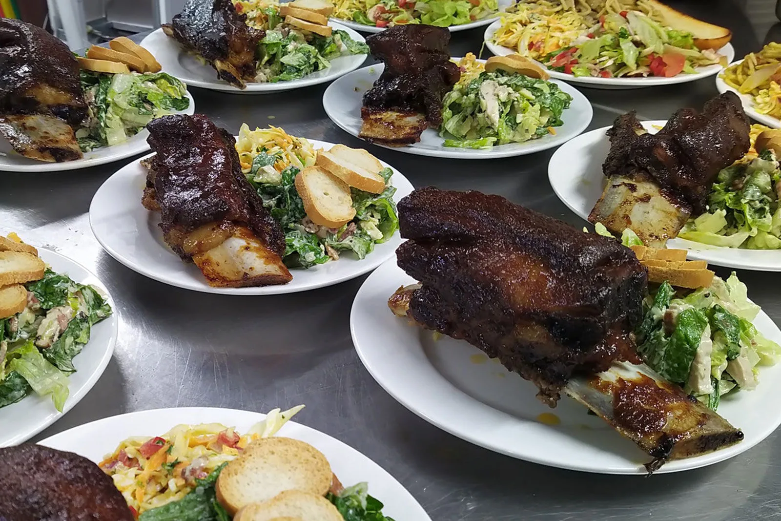 Hot dinner in the galley — ribs and sides plated up