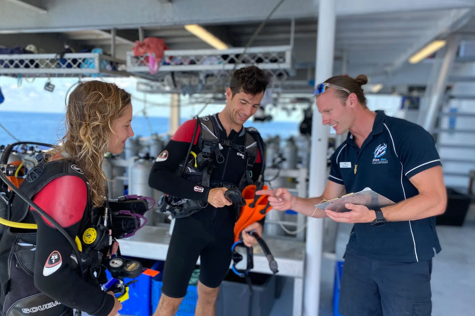 Instructor briefing divers on the dive deck