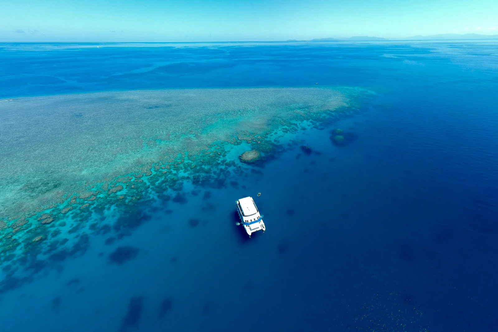 The vessel at the very edge of the outer reef, aerial panorama