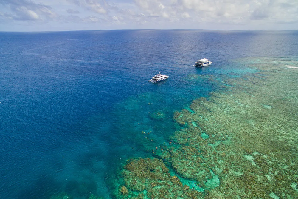 Ocean Quest and the transfer boat at the reef mooring
