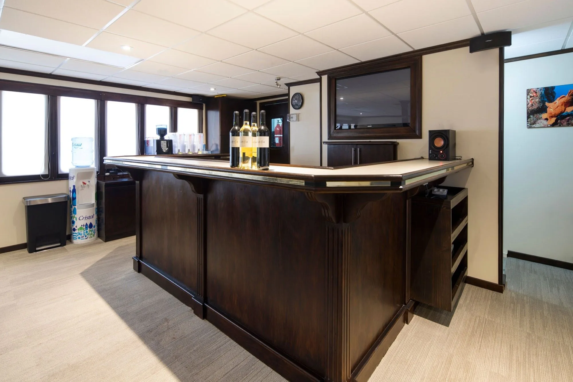Bar of Okeanos Aggressor II with television and coffee station