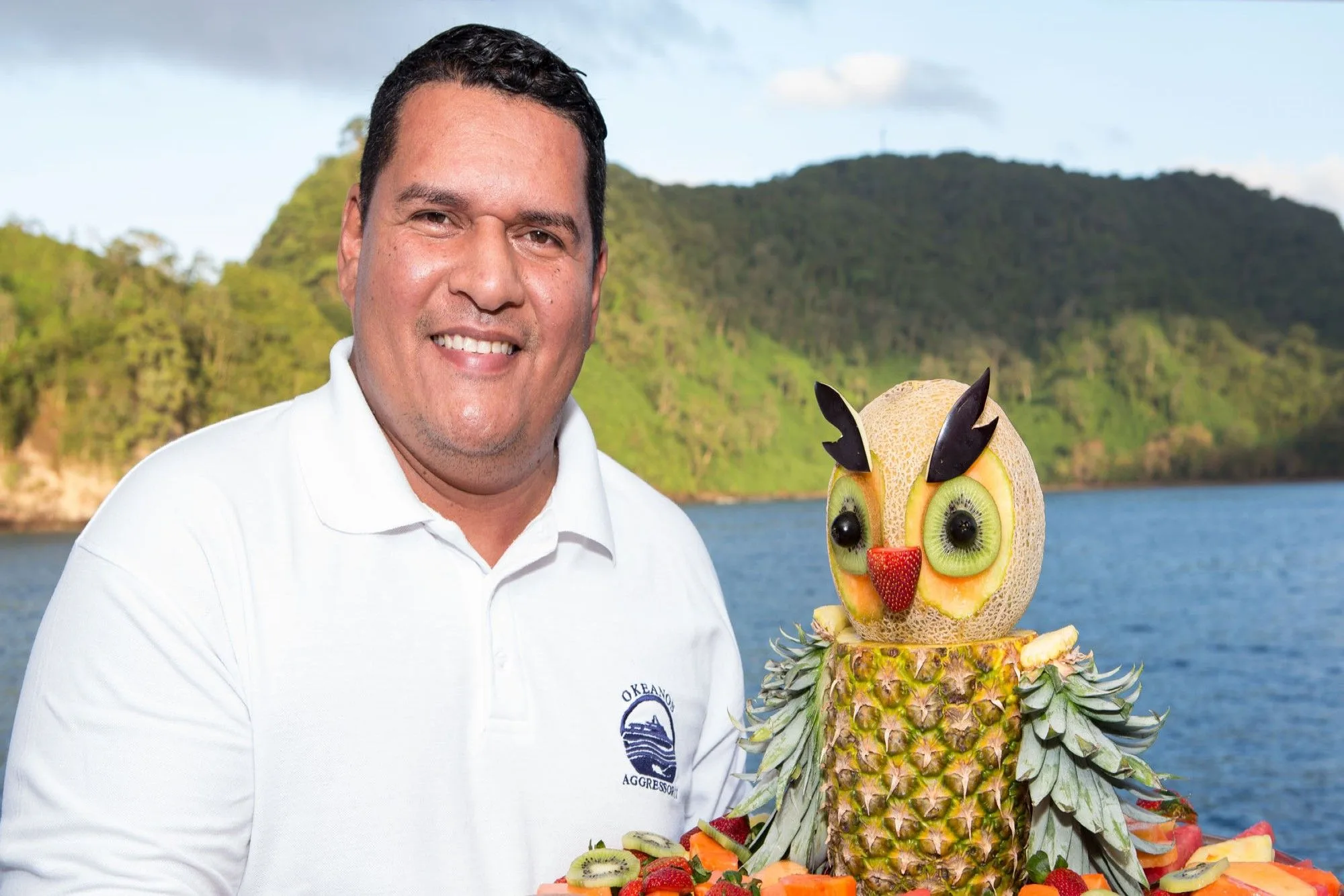 Okeanos Aggressor II chef with a carved fruit centrepiece