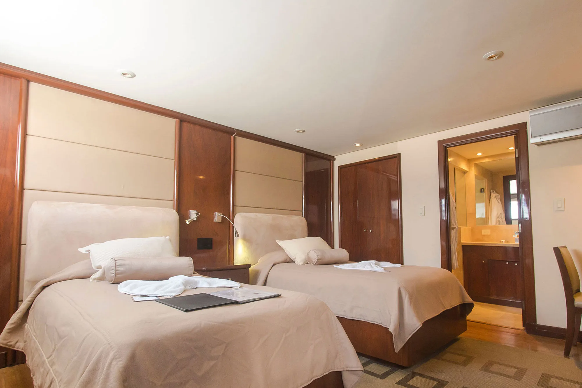 Suite No. 2 on Okeanos Aggressor II — twin beds and the bathroom door