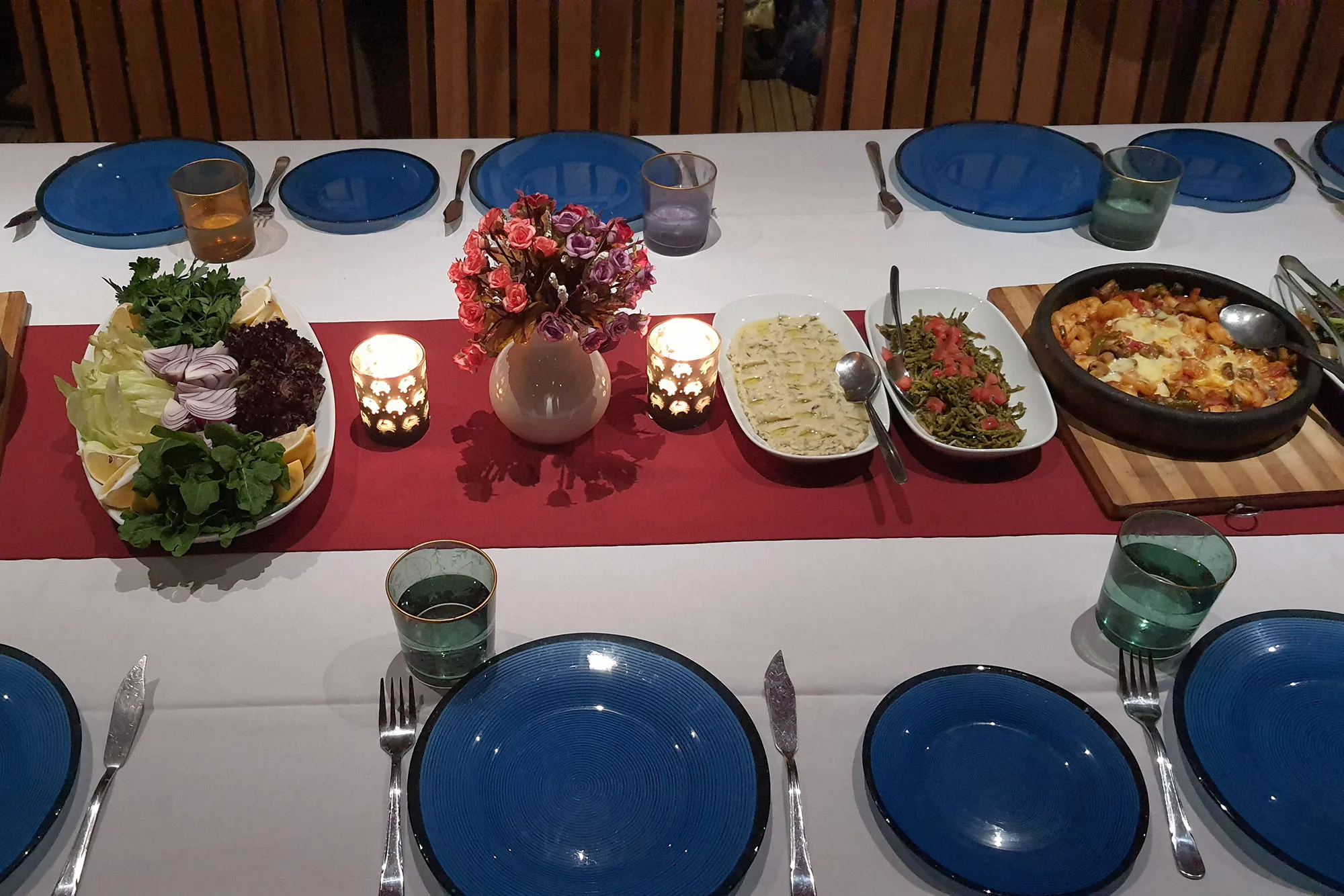 Evening table of Turkish dishes on blue plates