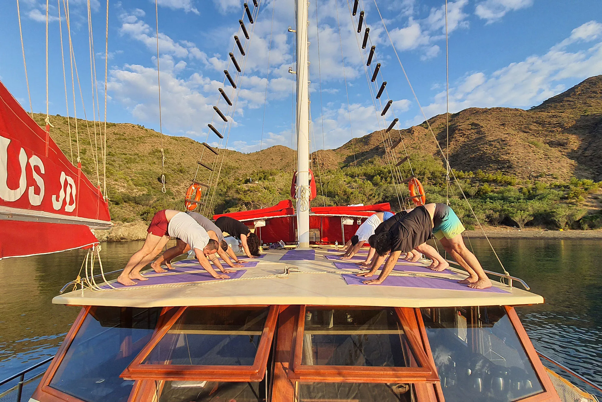 Morning yoga on the foredeck of Okyanus JD