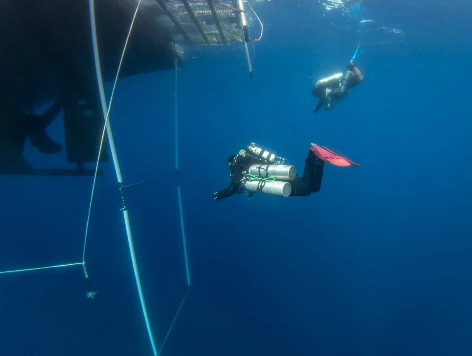Decompression bar hanging beneath the hull of Pacific Master