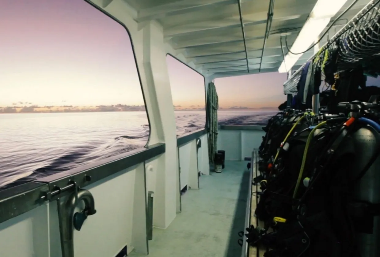 Dive deck of Pacific Master running along the hull at sunset