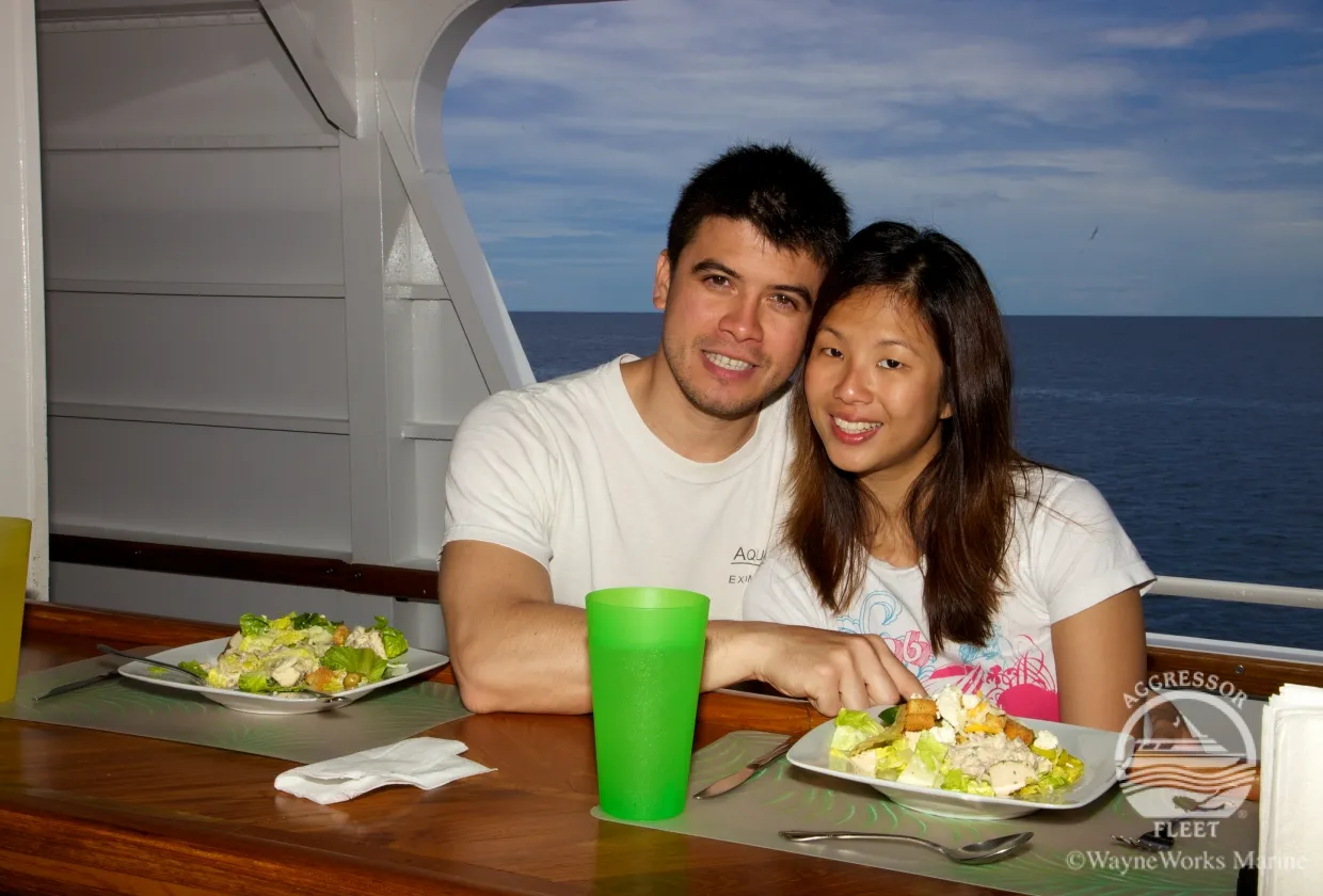 Guests at dinner by the picture window