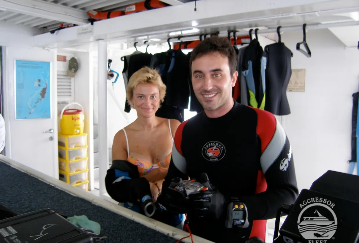 Divers in wetsuits on the dive deck