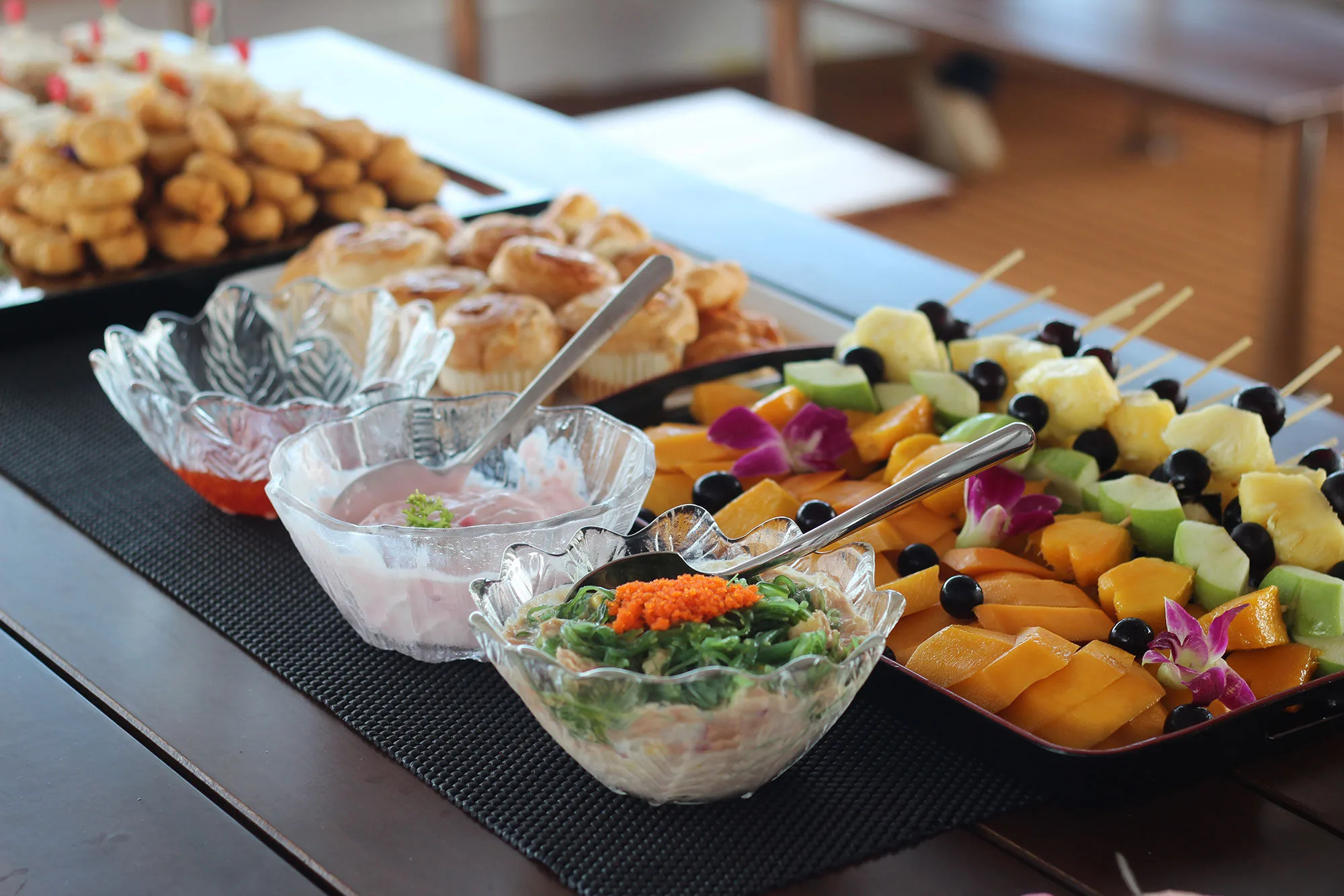 Pastries and fruit skewers on board Raga