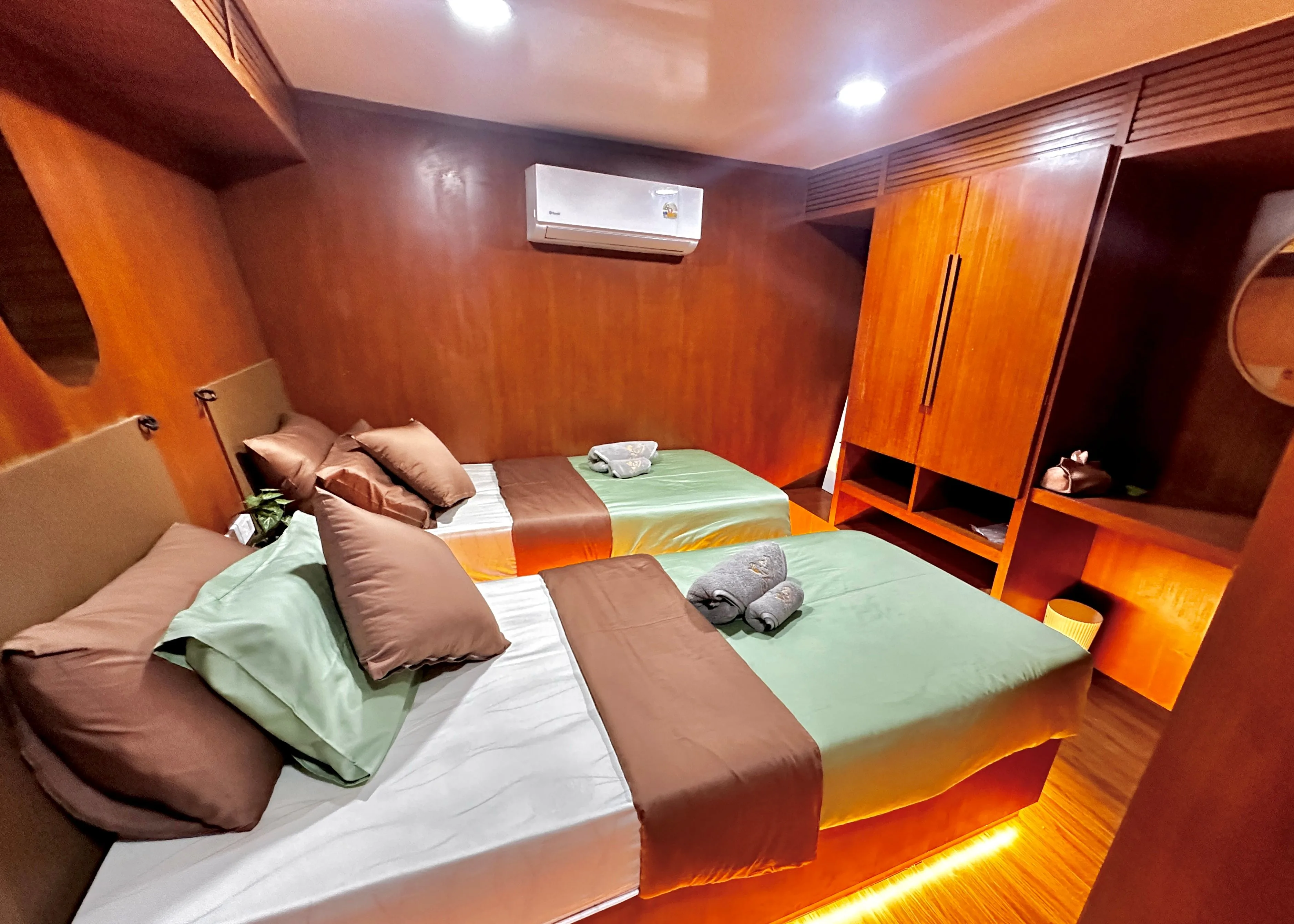 Raga lower deck cabin with two single beds and a wardrobe