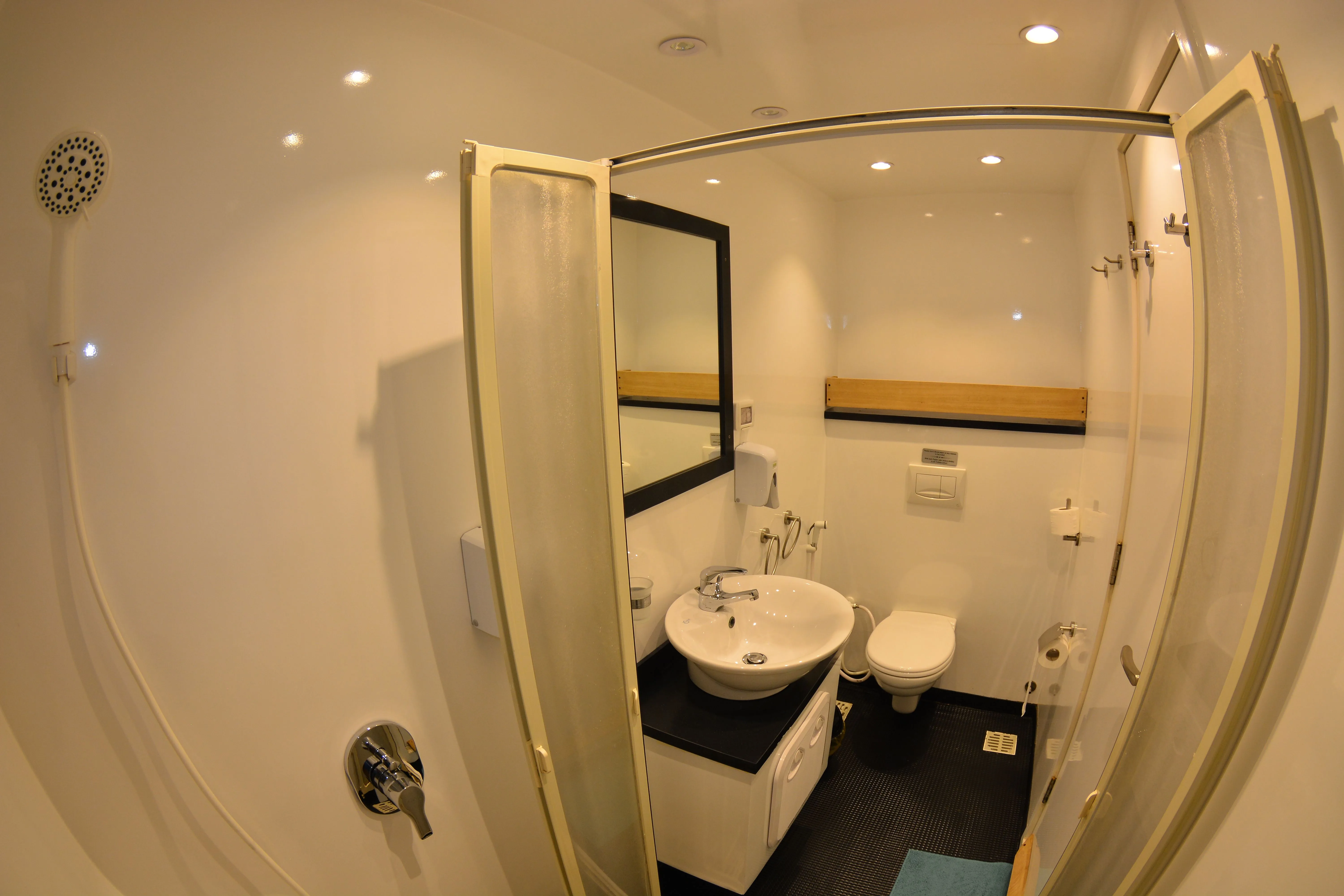Cabin bathroom — shower, basin and mirror