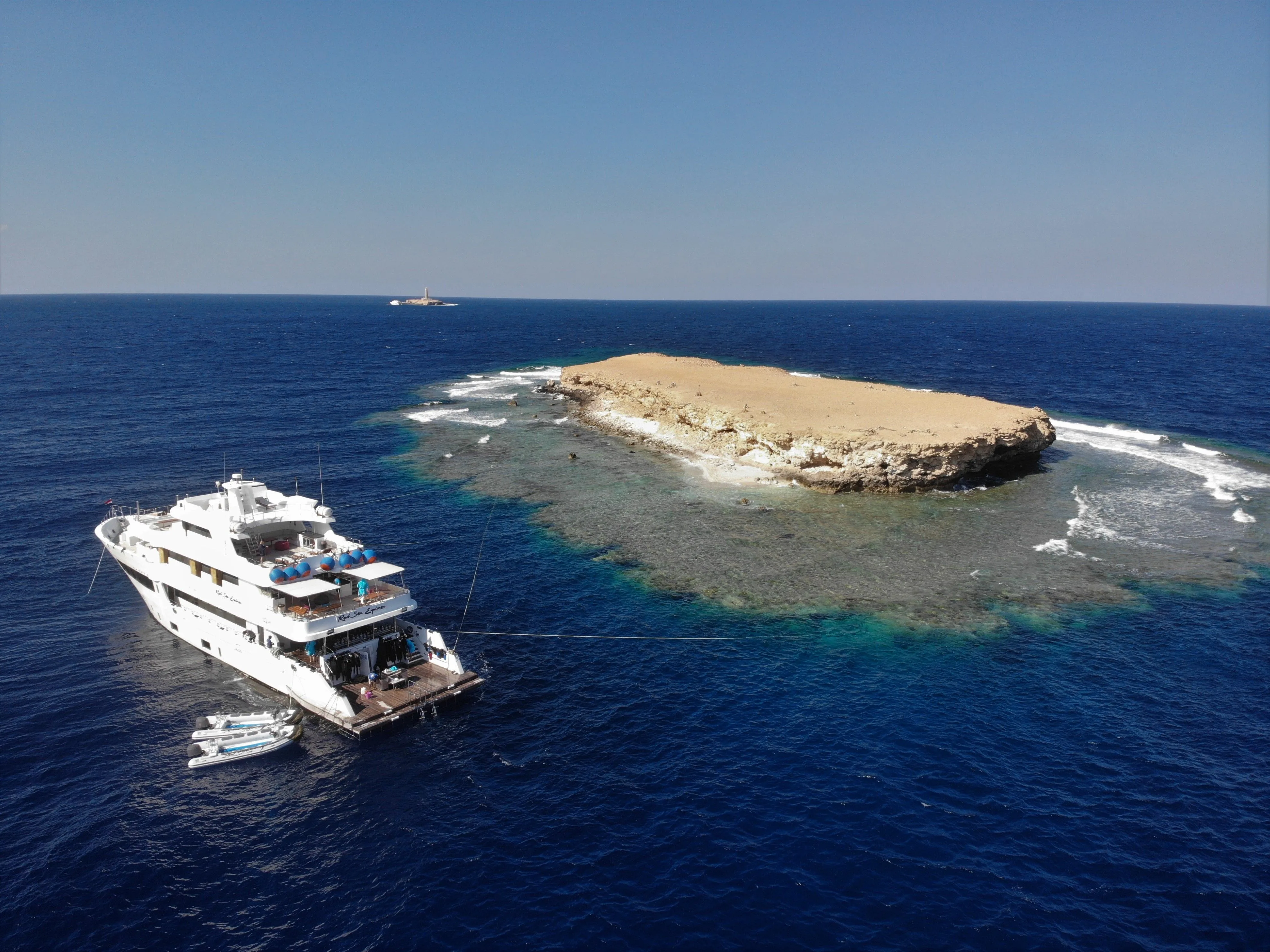 Aerial view of the vessel beside a reef
