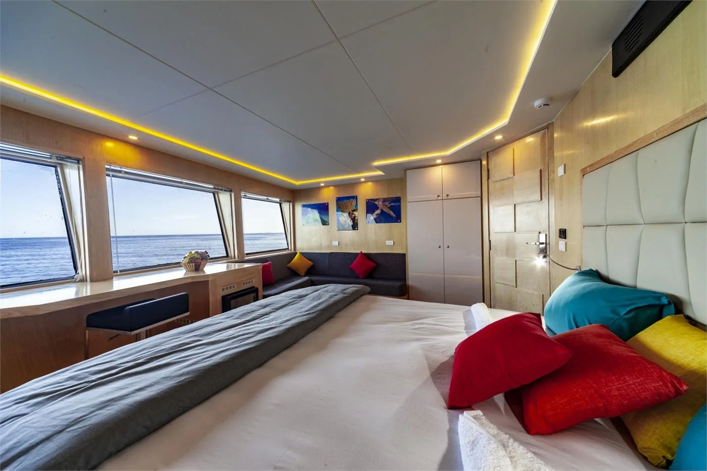Master Double cabin — bed along the hull and a run of windows