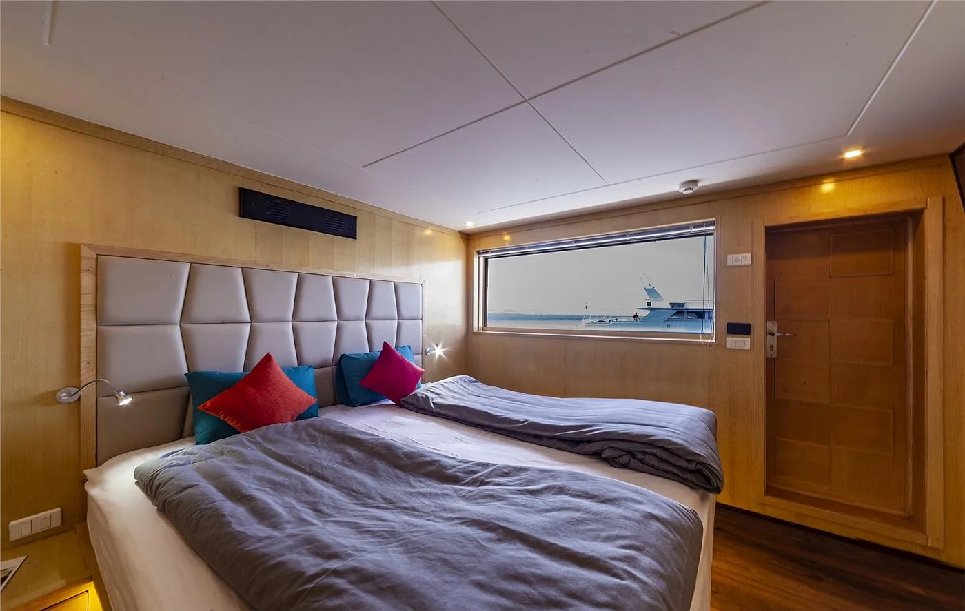 Superior upper deck cabin with an upholstered headboard