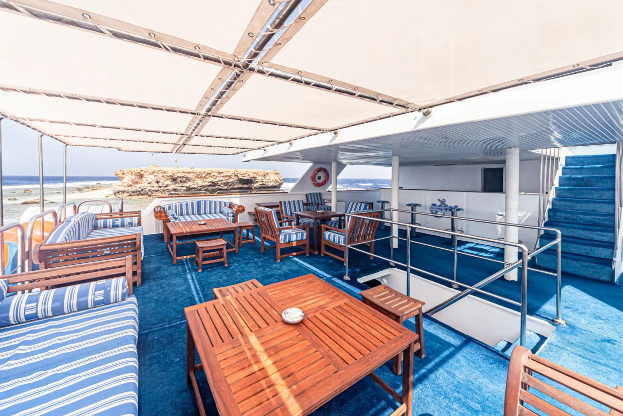 Shaded deck on Royal Evolution with teak furniture