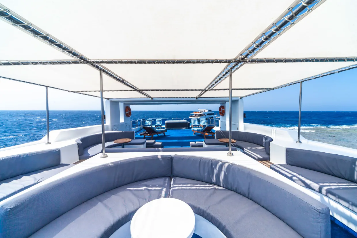 Upper sun deck of Royal Evolution with curved banquettes