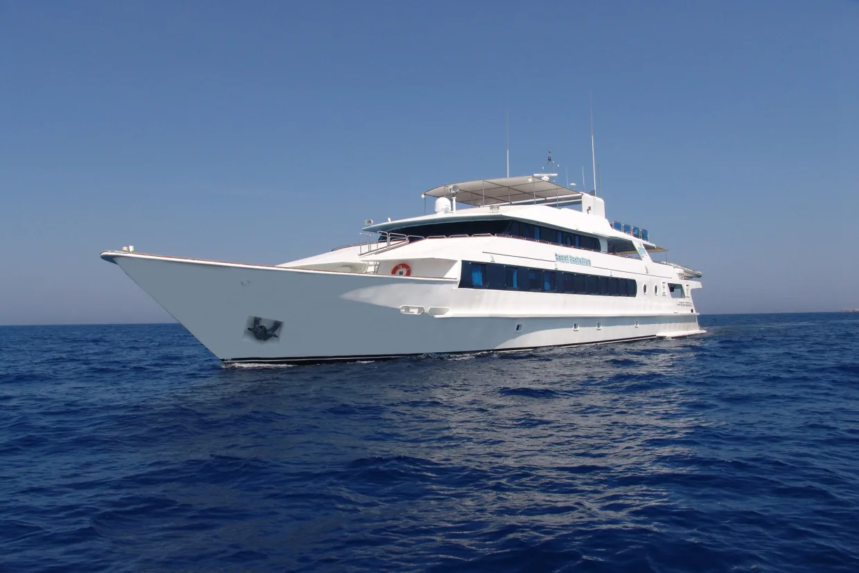 The white steel hull of Royal Evolution seen from the bow