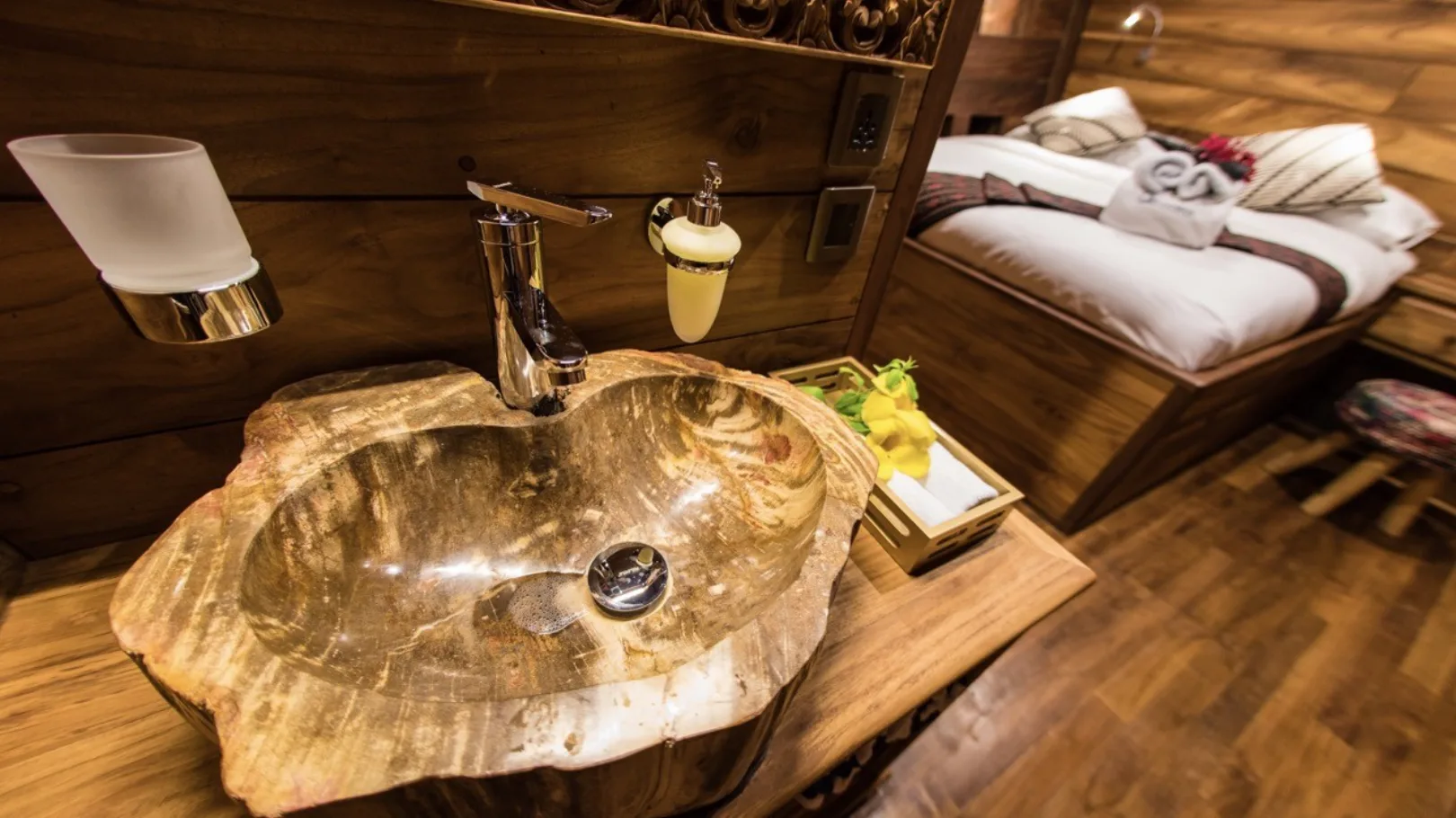 Fossil-wood washbasin in a lower-deck cabin bathroom
