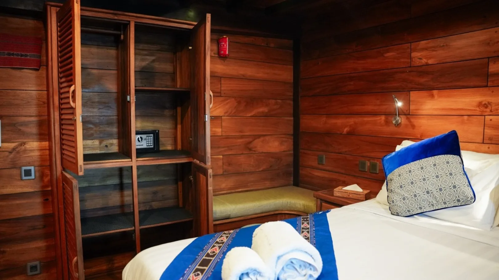 Glass-fronted wardrobe and a working corner in the double cabin
