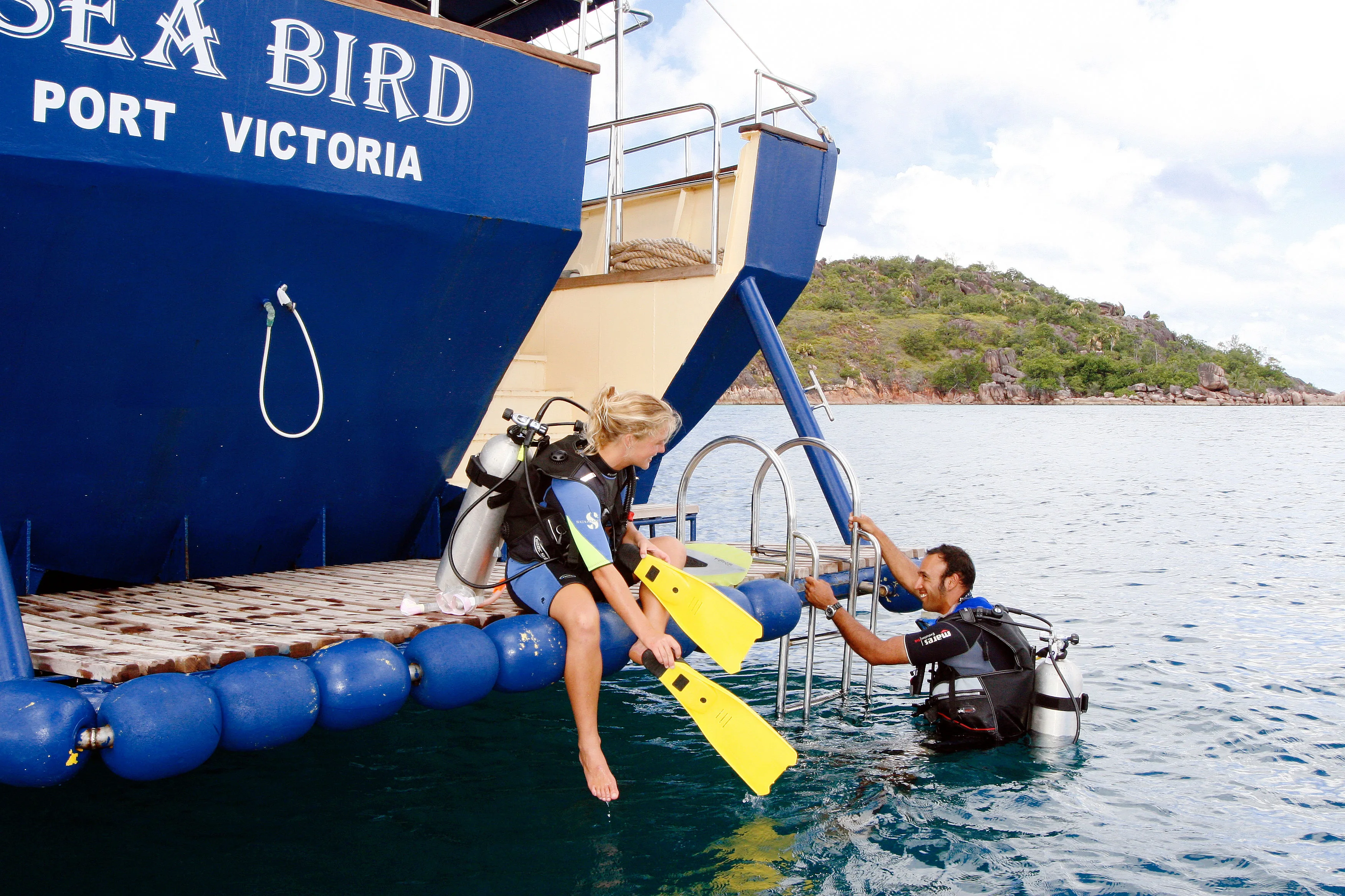 Dive platform alongside the hull lettered SEA BIRD, PORT VICTORIA