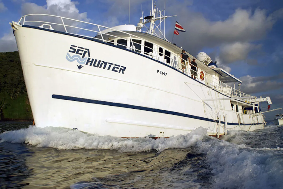 Sea Hunter under way, her name across the white hull