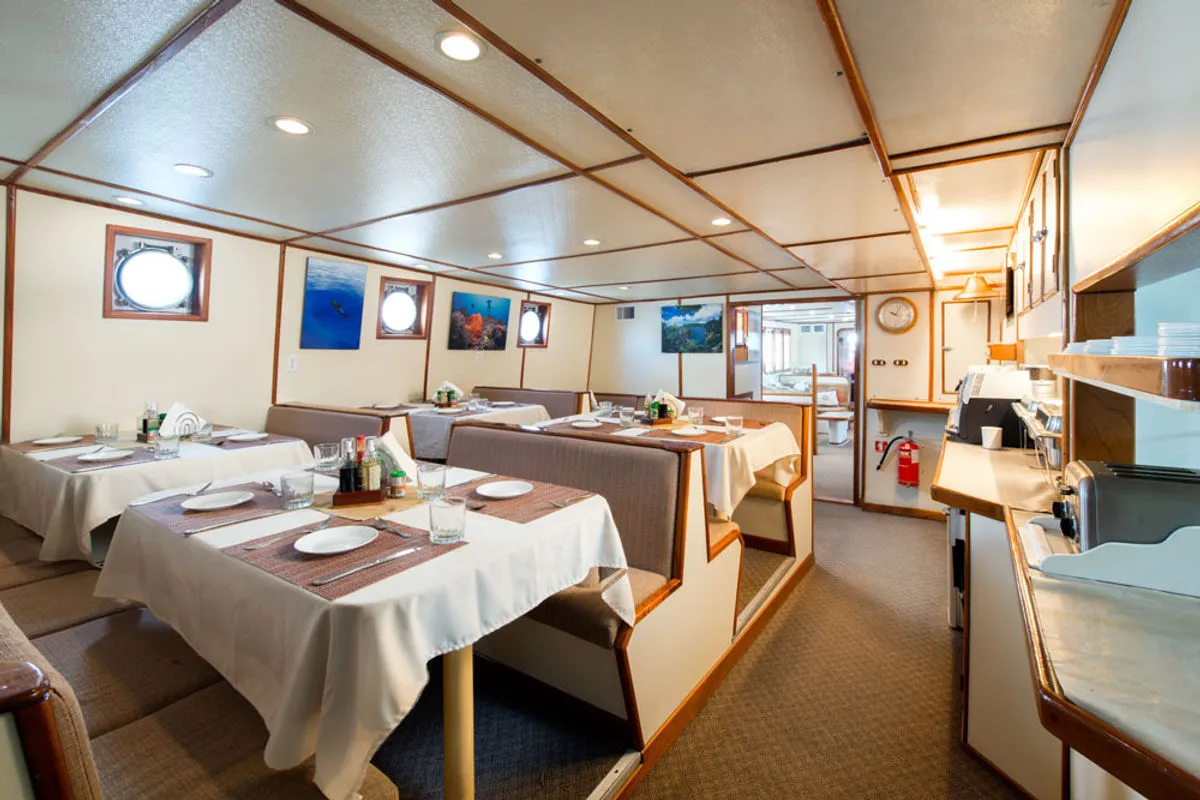 Tables laid in the dining room on board