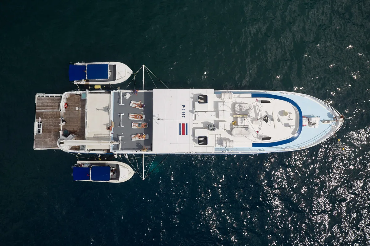 Sea Hunter from above with both dive skiffs made fast alongside