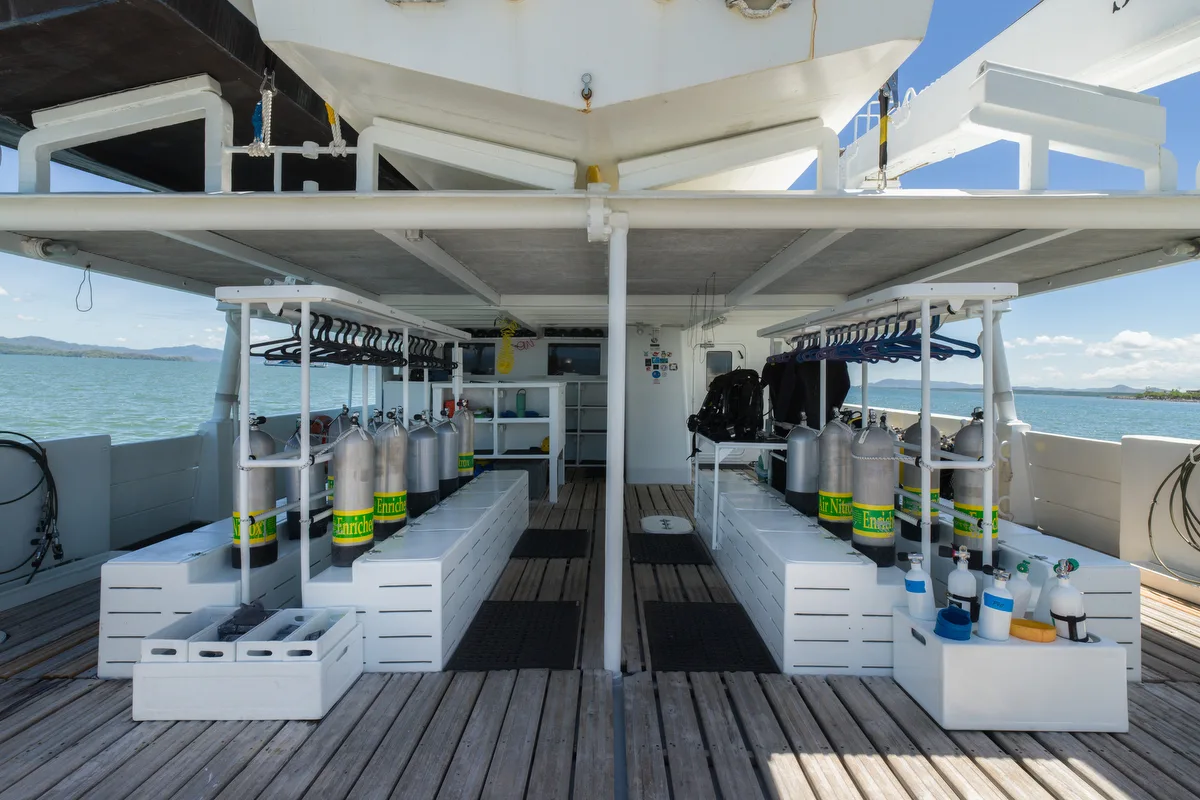 Sea Hunter's dive deck with teak planking and tank racks