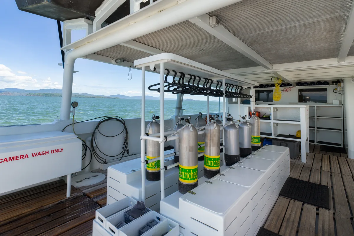 Tanks in their racks beside the underwater camera rinse station
