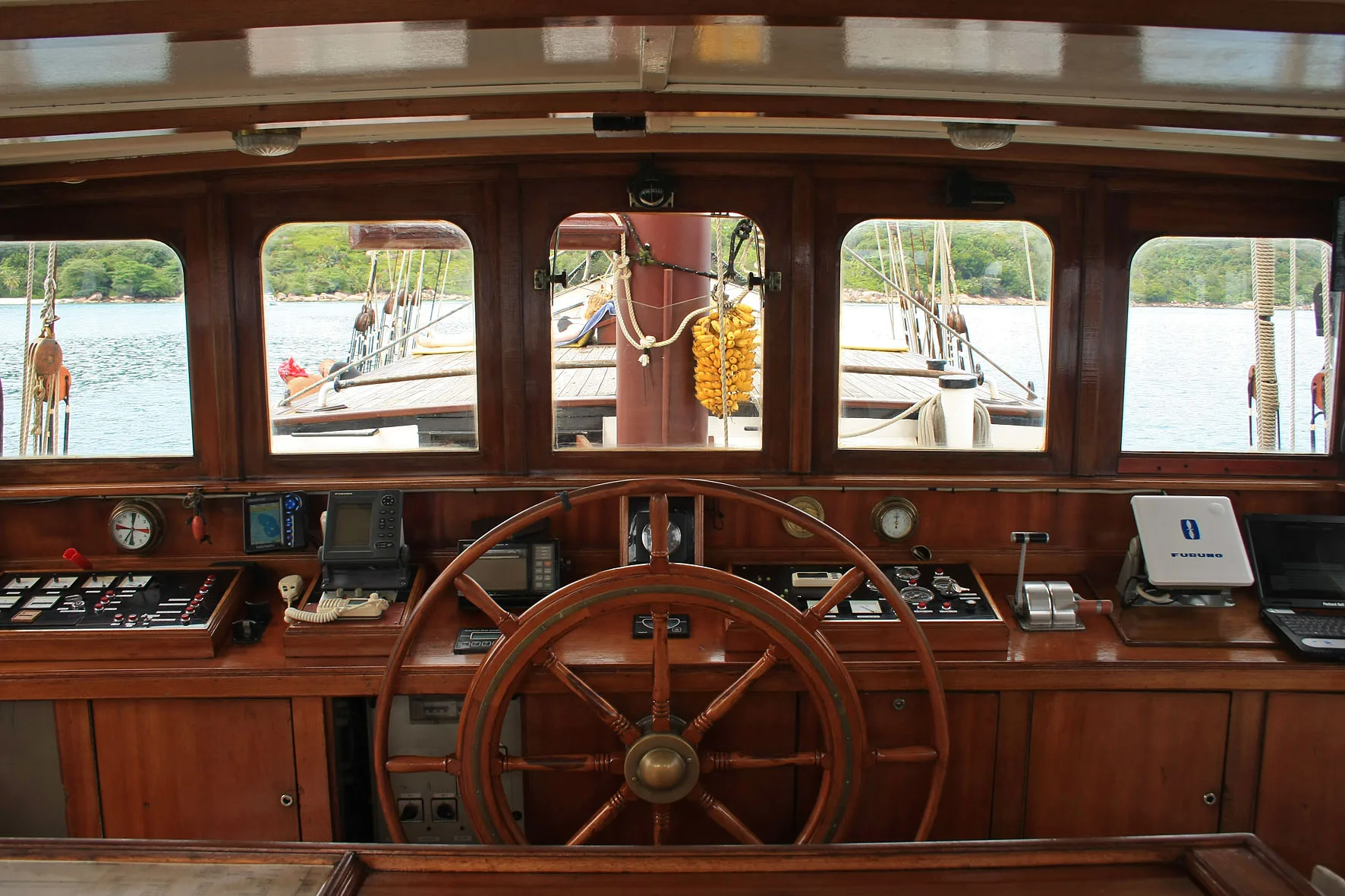 The wheelhouse of Sea Pearl with its timber wheel and instruments