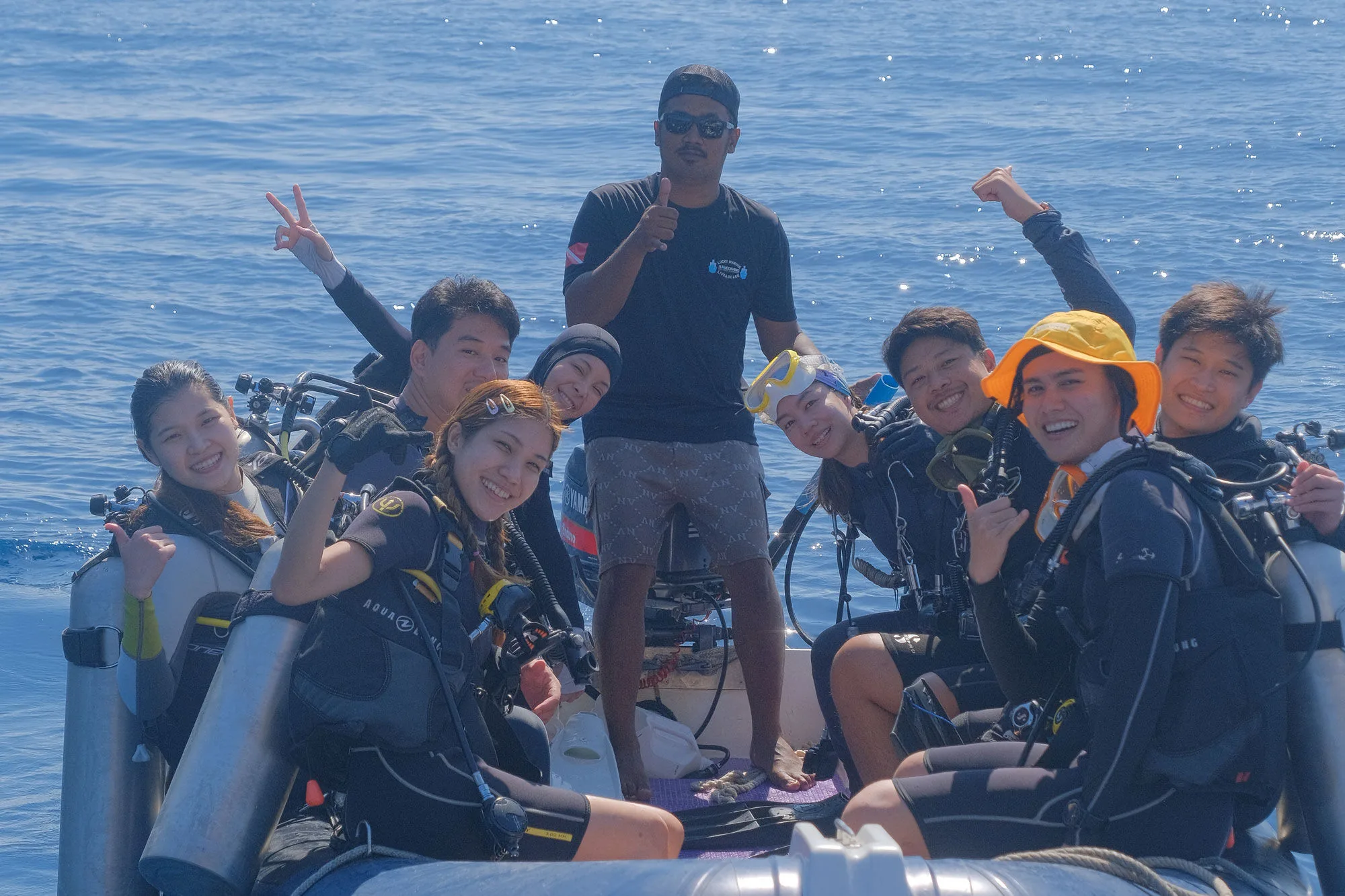 A group of divers in the tender before the dive