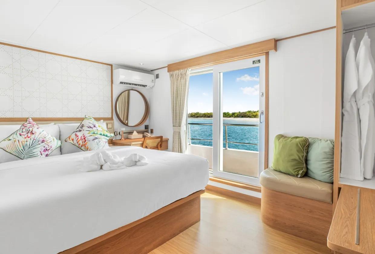 Cabin 303 on the upper deck of Solitude Gaia with a king-size bed