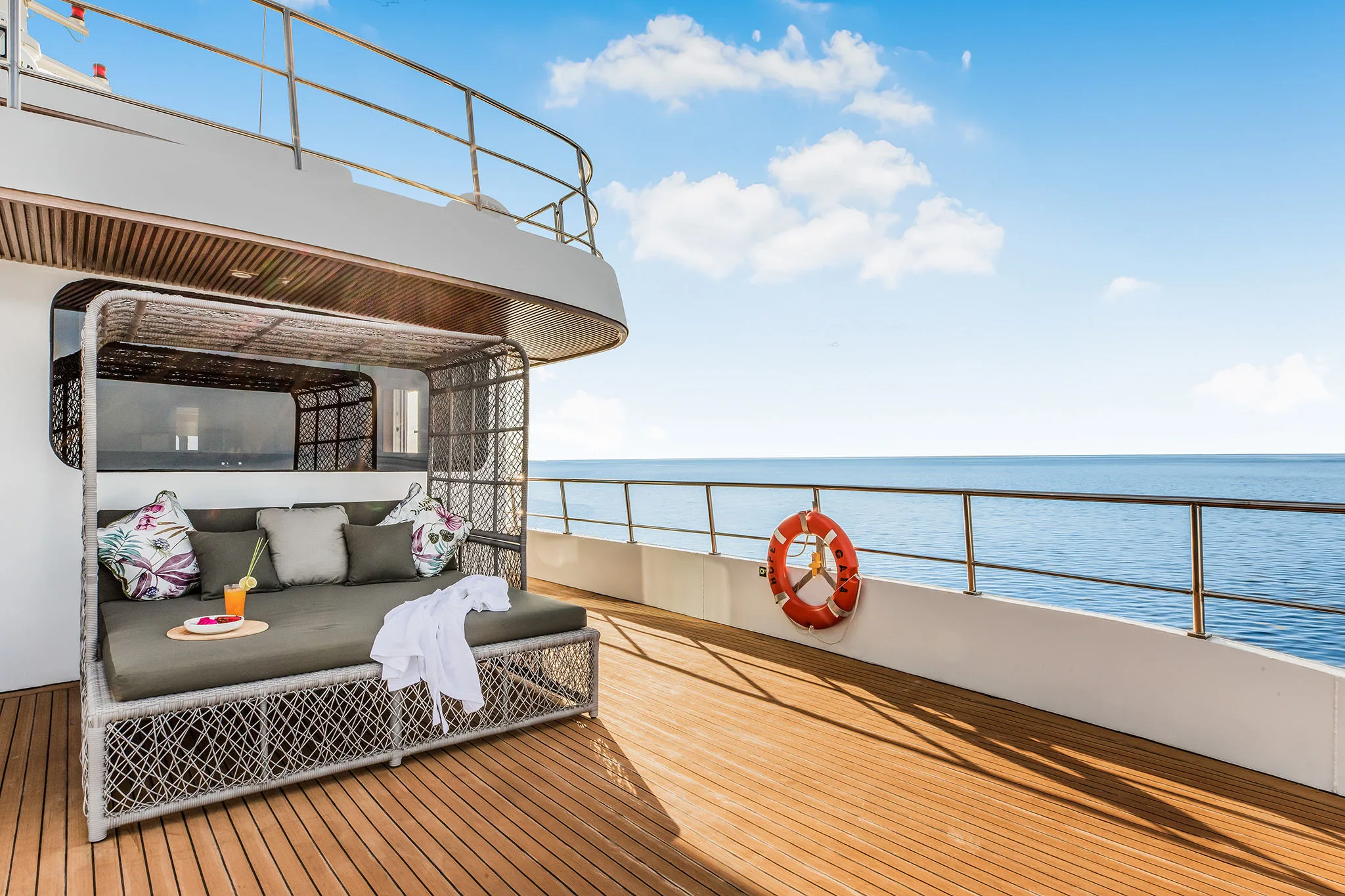 Outdoor day bed on the stateroom deck of Solitude Gaia