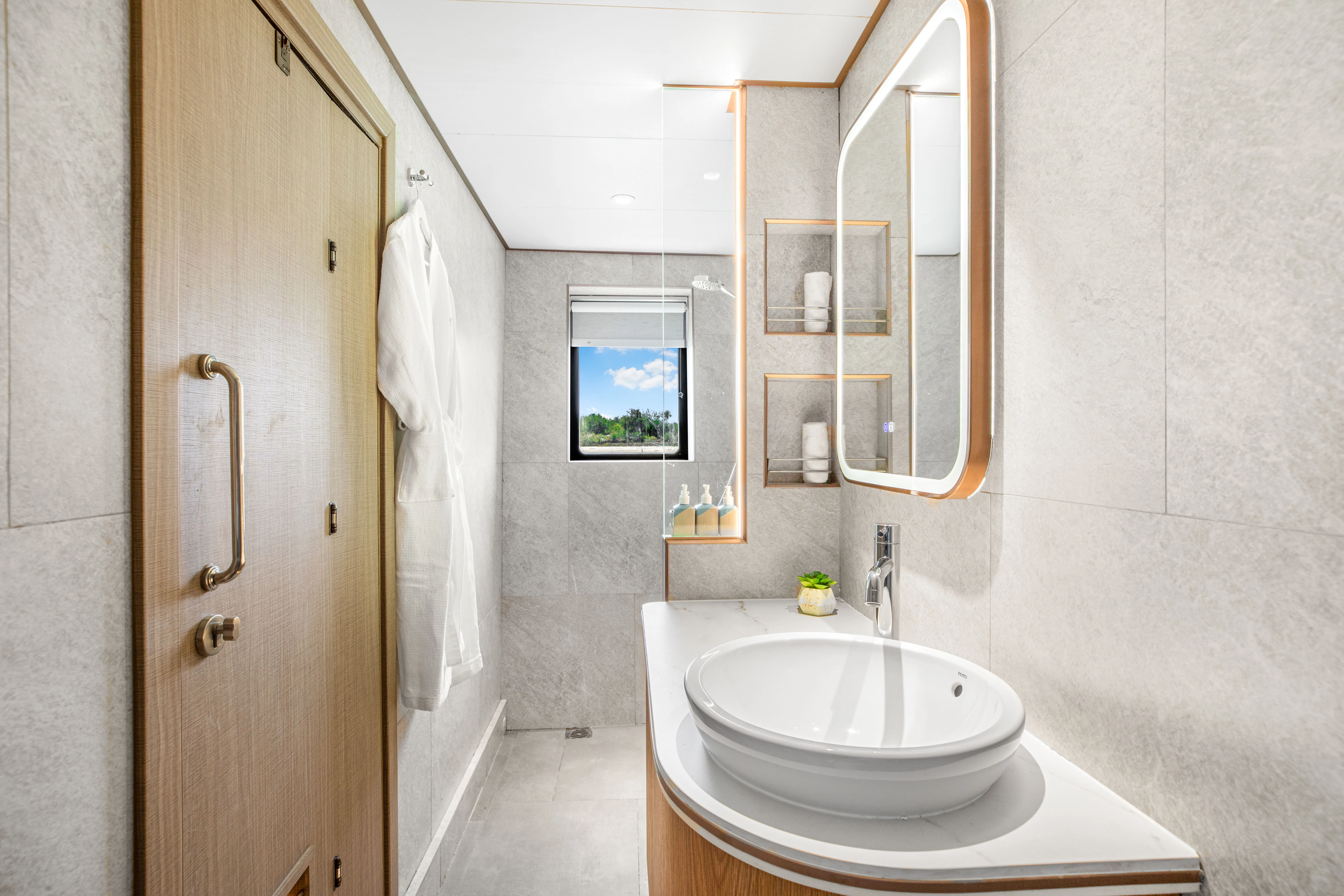 Upper deck cabin bathroom on Solitude Gaia with a shower cubicle