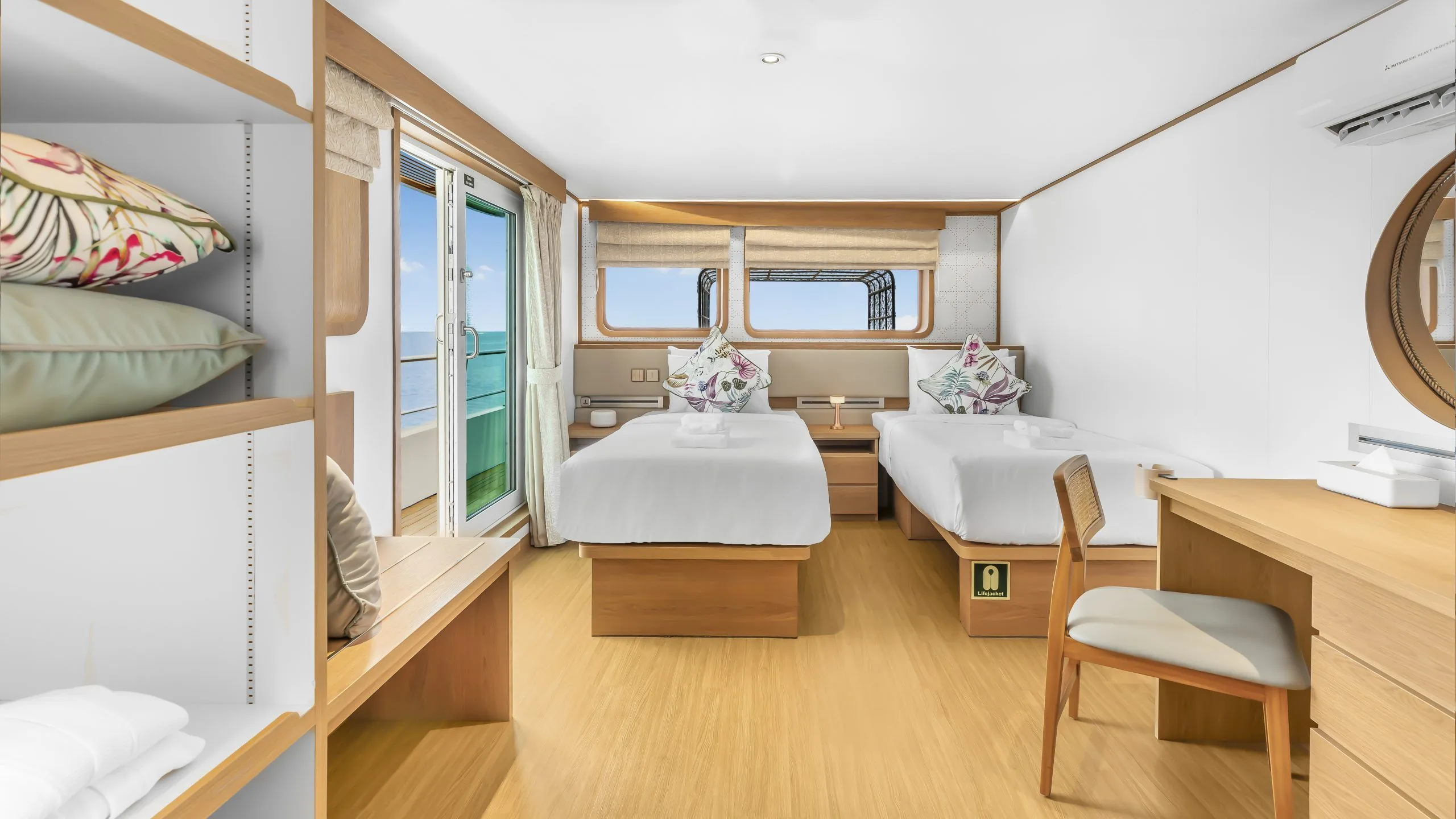 Cabin on Solitude Gaia with portholes and bathrobes