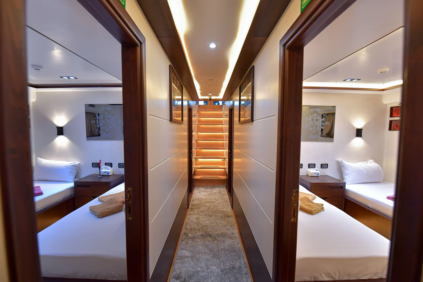 Lower deck corridor with the stairway and open cabins