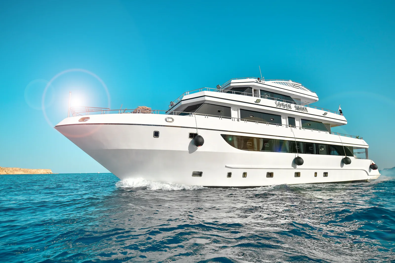 The white steel hull of South Moon 1 with her name on the superstructure