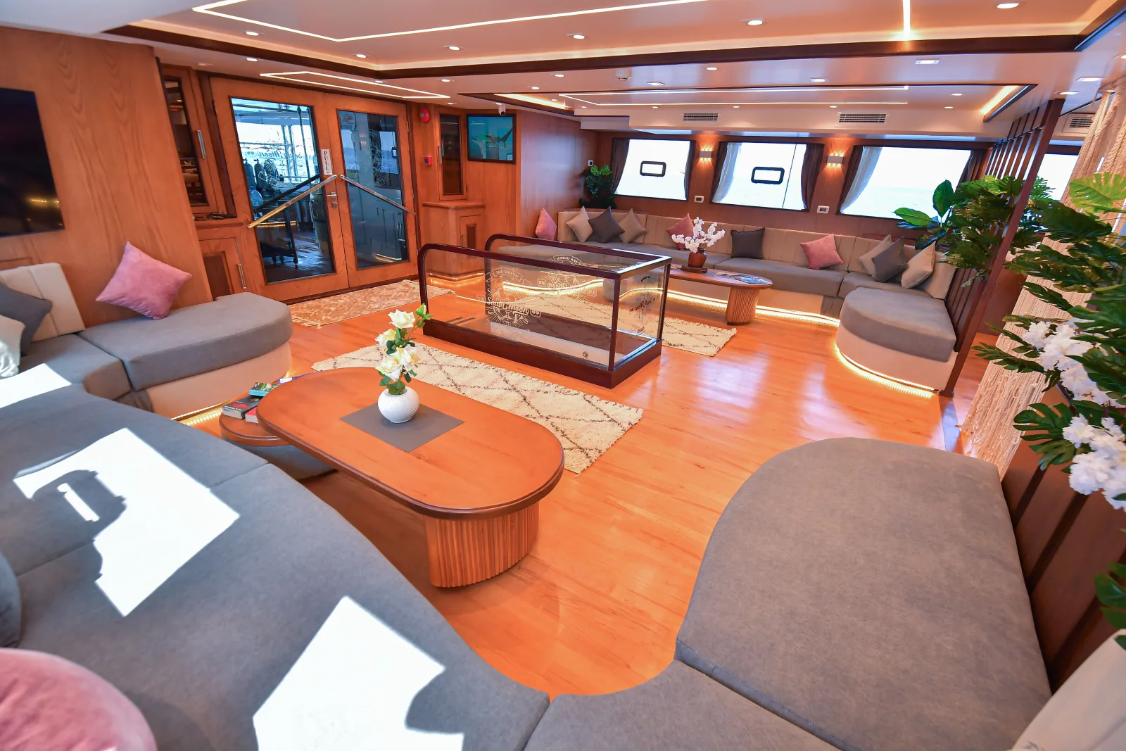 Wood-panelled salon — sofas, rug and table