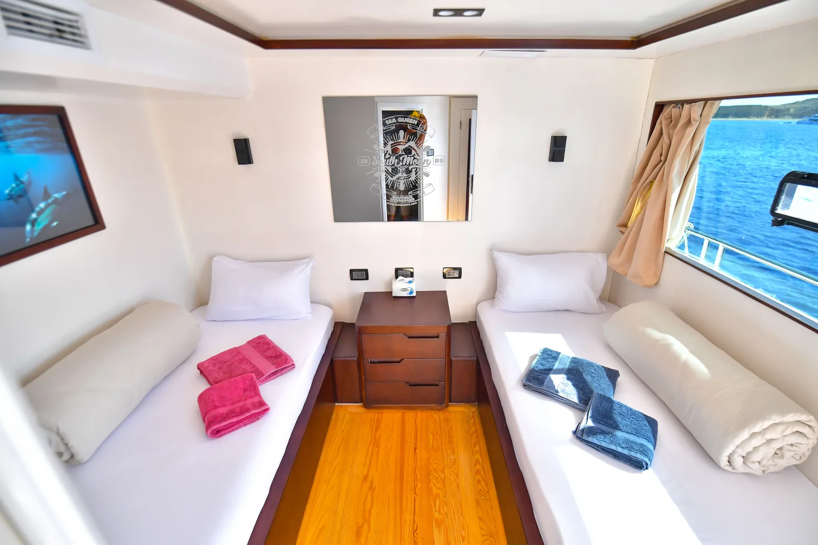 Comfort cabin on the upper deck of South Moon 1 — two beds and a large window