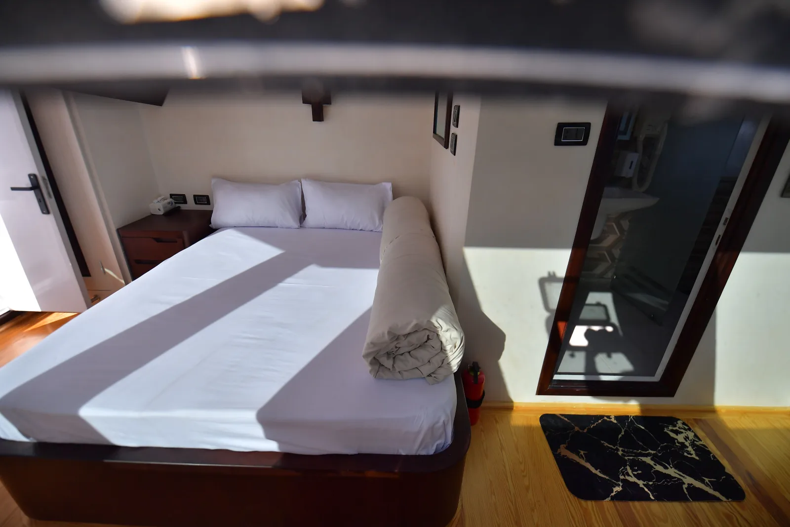 Suite — the made-up bed and the entrance to the bathroom