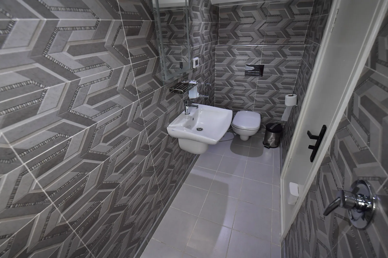 En-suite bathroom of a lower deck cabin with basin and shower