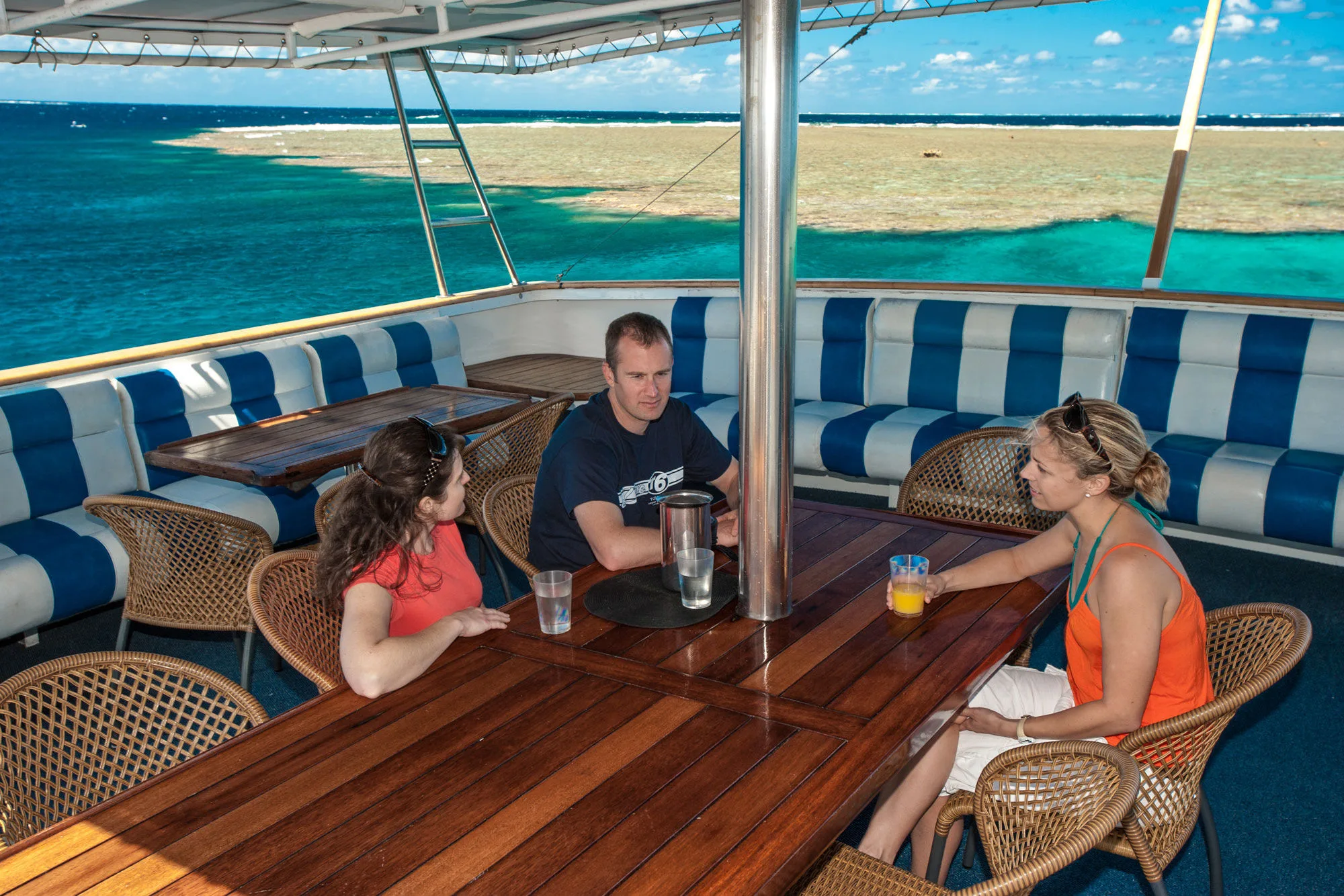 Lunch on the open aft deck with the reef behind