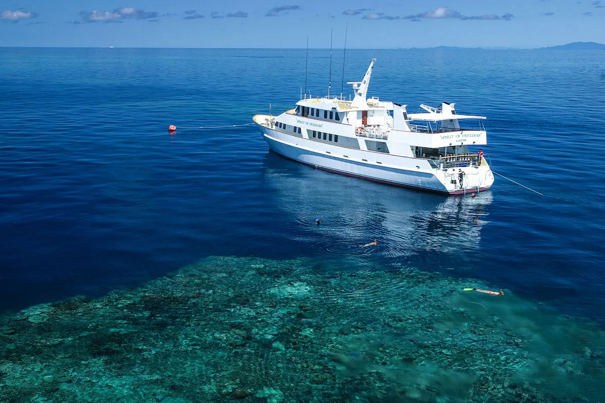 Spirit of Freedom from the air at the reef edge in turquoise water