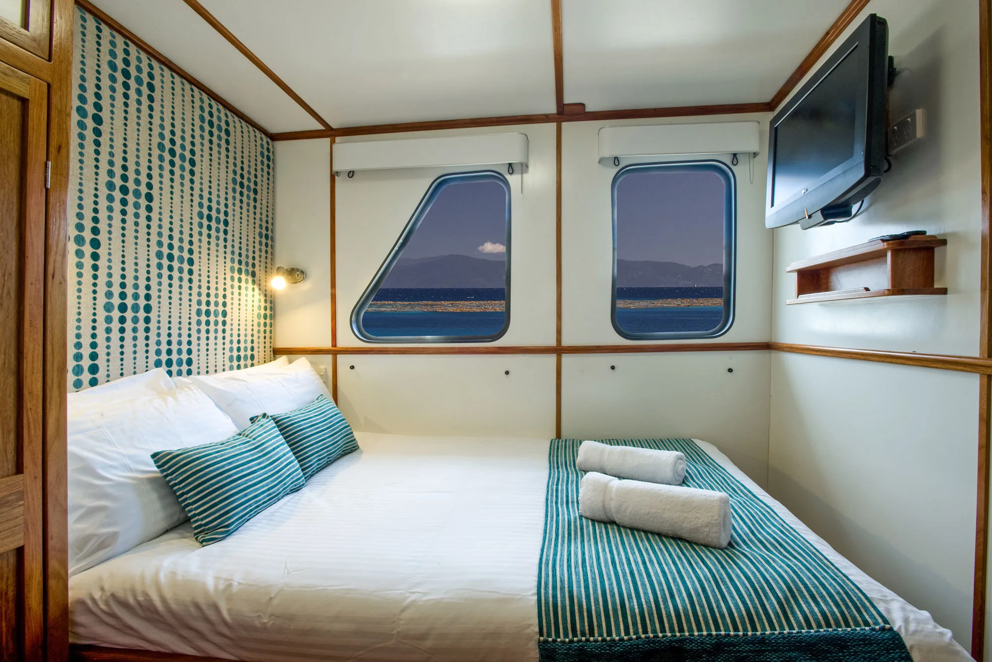 Ocean View Standard on Spirit of Freedom — sea-facing windows above the bed